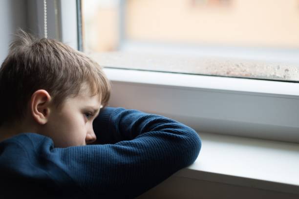 istock Sad alone little boy child 900637052
