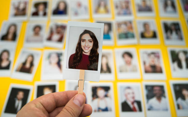 Choosing an employee Polaroid photo of a caucasian woman. choosing photos stock pictures, royalty-free photos & images