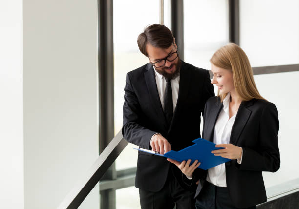 istock Business coworkers discussing  reports 900644374