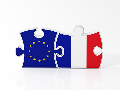 Jigsaw puzzle pieces textured with European Union and French  flags on white. Horizontal composition with copy space. Clipping path is included.