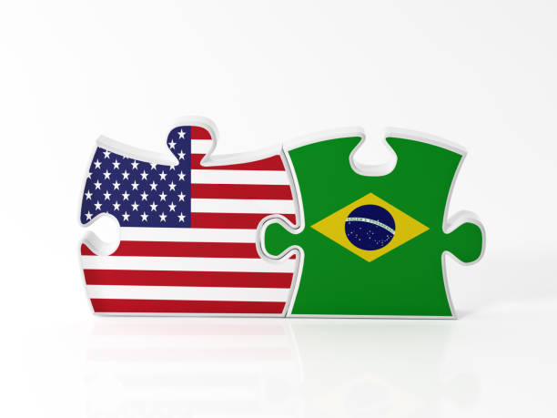 istock Jigsaw Puzzle Pieces Textured With American And Brazilian Flags 900655170