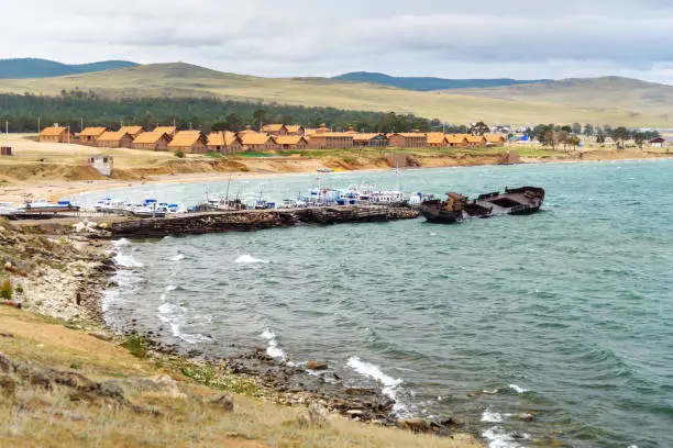 View of Pier with ships and beach in Khuzhir Village on Olkhon Island, Siberia, Russia