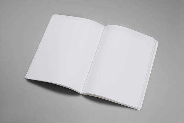 istock Mock-up magazines, book or catalog on gray table background. 900655534