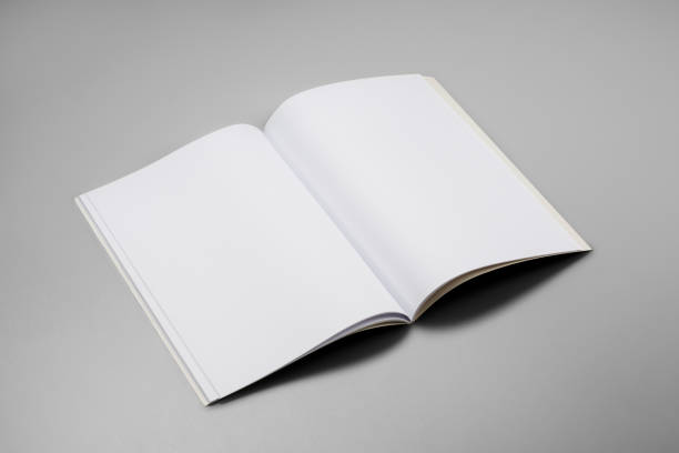 istock Mock-up magazines, book or catalog on gray table background. 900658012
