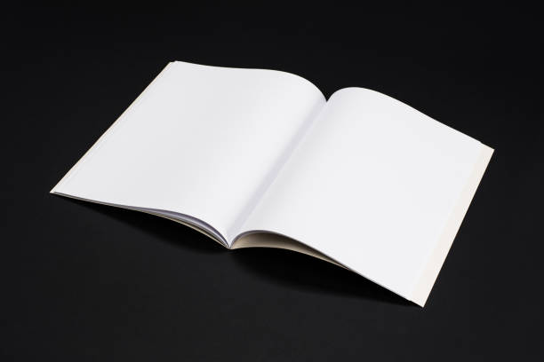 istock Mock-up magazines, book or catalog on black table background. 900658190