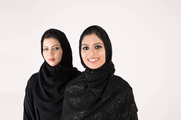 istock Young arab females standing together 900662604