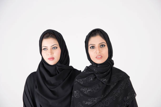 istock Young arab females standing together 900662616