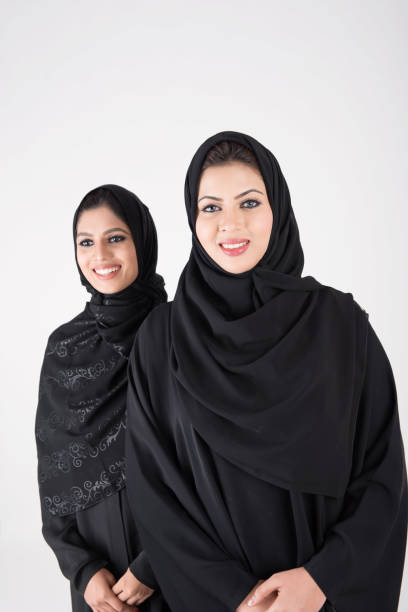 istock Young arab females standing together 900662642