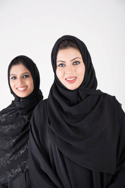 istock Young arab females standing together 900662646