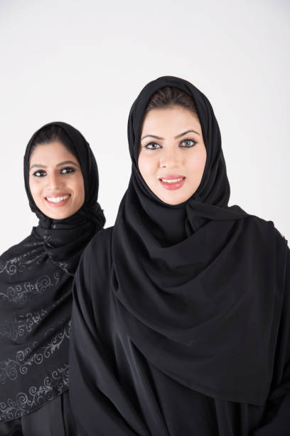 istock Young arab females standing together 900662648