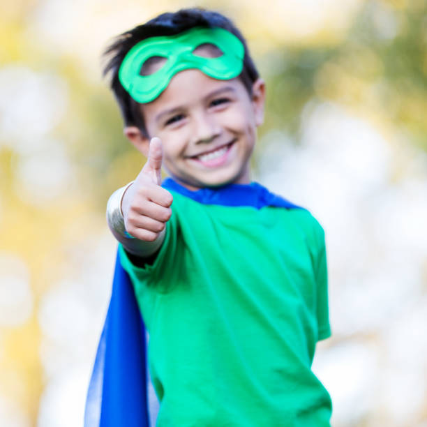 istock Young superhero gives a thumbs up 900664916
