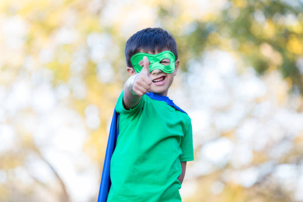 istock Cute little boy dressed in superhero costume 900664924
