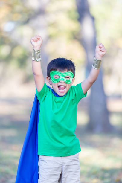 istock Happy young super hero shouting 900664952