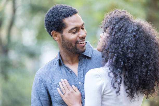 istock Young couple dances outside in the sunlight 900665054