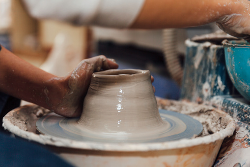 Hands working on clay's