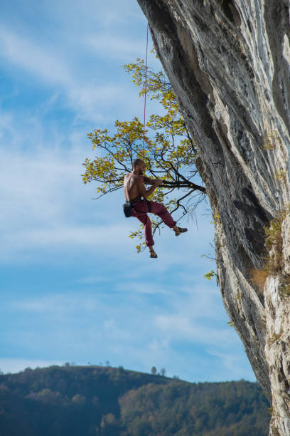 istock Extreme autumn,rock climbing 900666060