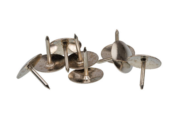 istock Group of metal thumb tacks on a white background 900666706