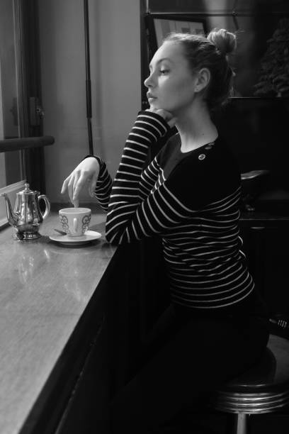 istock girl young  enjoying hot tea. 900677036