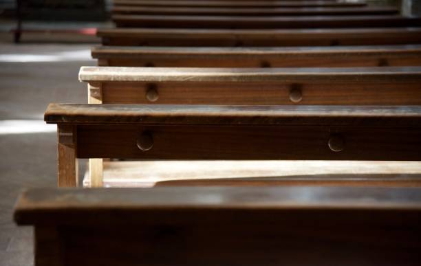 istock Wooden church benches 900685372