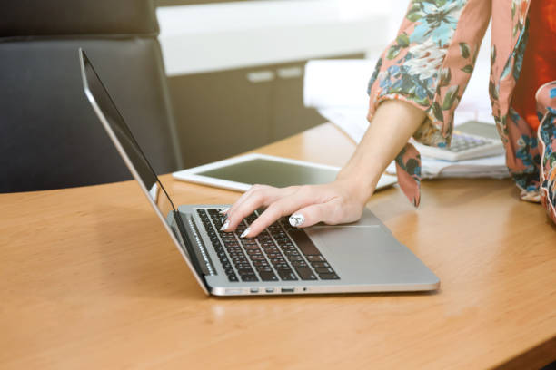istock Woman used notebook for her work in the office. 900691258