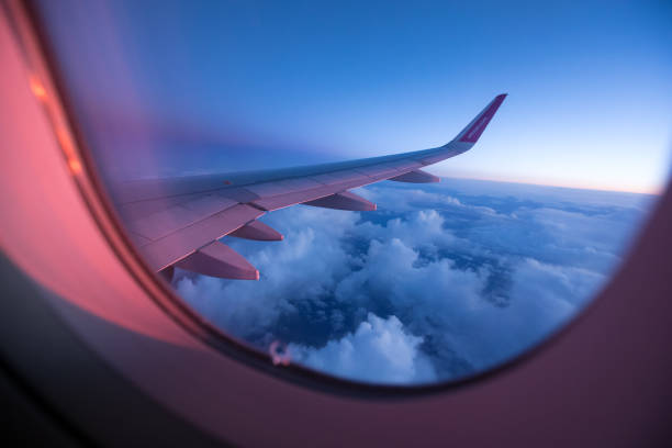 istock Sunset sky from the airplane window 900699870