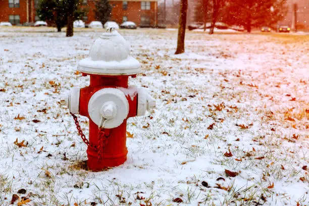 Photo of Fire Hydrant in winter, on snow covered street.