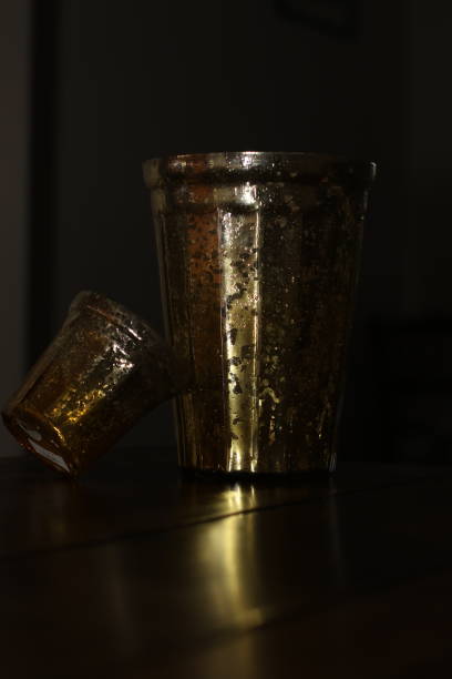 istock Shadow of a golden vase 900707316