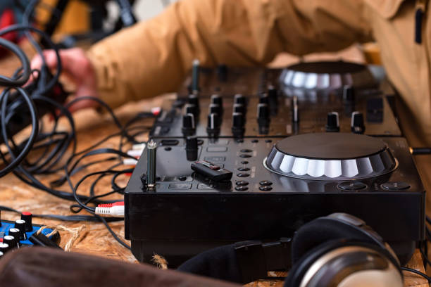 istock Close-up of DJ's audio mixing console 900722250