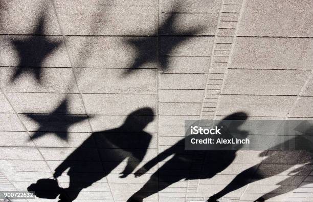 Shadow Silhouette Of People On City Sidewalk Stock Photo - Download Image Now - European Union, Shadow, Celebrities