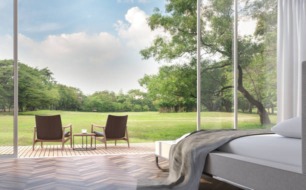 istock Modern bedroom with garden view 3d rendering image 900727022