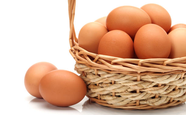 istock Basket full of eggs on white background 900731610
