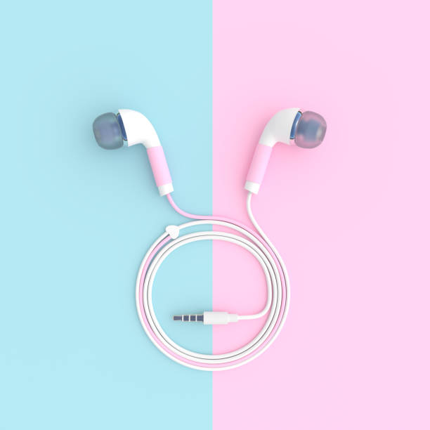 istock pink earphone on blue and pink pastel color background with clipping path 900734264