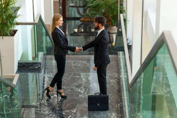 istock Business people shaking hands in office 900739234
