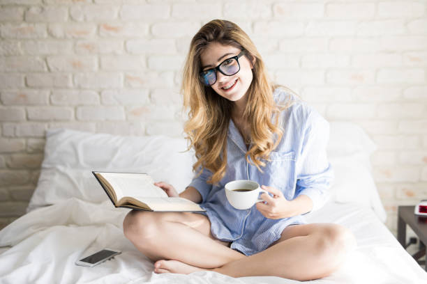 istock Cute woman loves reading and coffee 900742958
