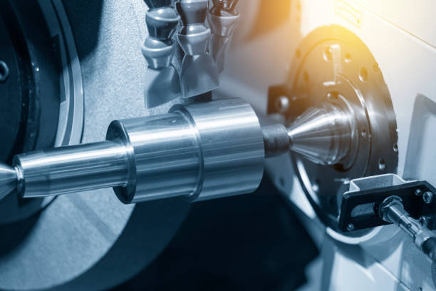 istock The cylindrical grinding machine with the steel shaft. 900745812