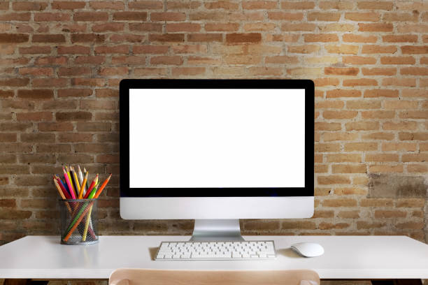 istock Mock up : Workspace with blank white desktop computer, pencils and stationery items. Blank screen for graphics display montage. 900754266