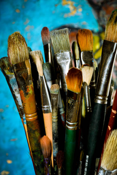 istock Artist oil paint brushes in stacks 900754834