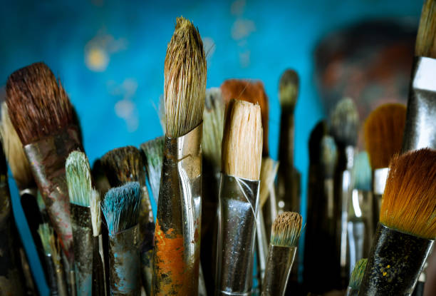 istock Artist oil paint brushes in stacks 900754870