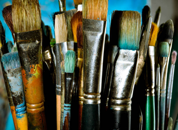 istock Artist oil paint brushes in stacks 900754980