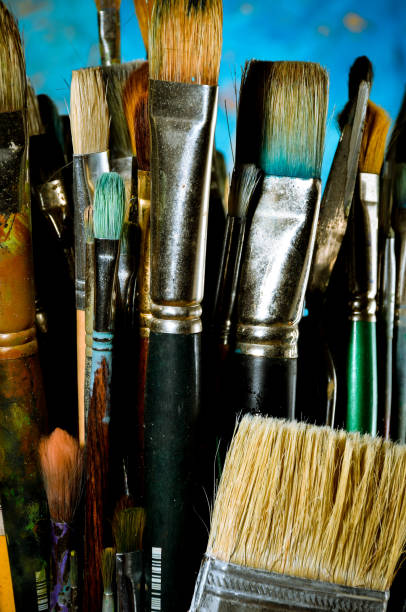 istock Artist oil paint brushes in stacks 900755020