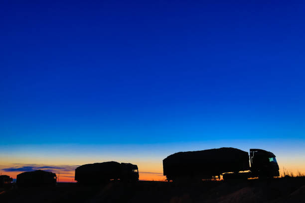 istock Transport convoy in the sunset 900755060