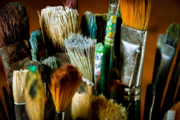 istock Artist oil paint brushes in stacks 900755090