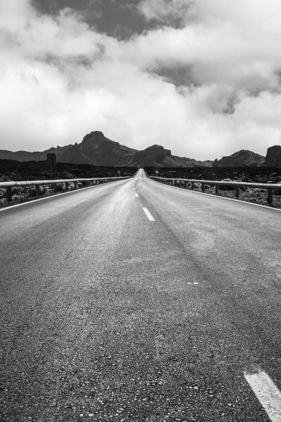 istock Solitary road among the mountains 900759000