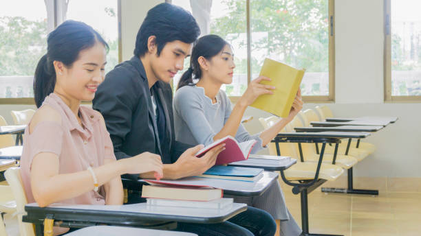 istock people student read book and sit in lecture chairs 900767806