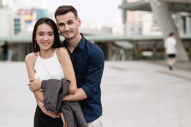 istock Happy young interracial couple. 900770388