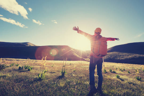 istock backpacking female hiker hiking in sunrise mountains 900774774