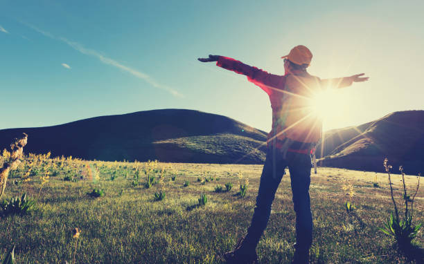 istock backpacking female hiker hiking in sunrise mountains 900774994