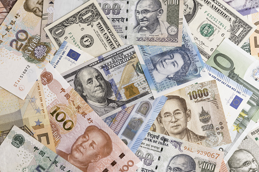 International banknotes from world major countries using as Forex or financial economy background, US dollar, UK pound, Euro, Japanese yen, Indian rupee, Chinese yuan, Thai Baht.