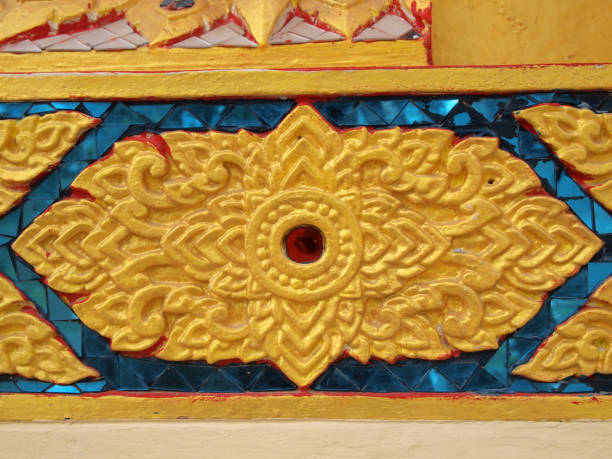 istock Thailand pattern on walls of buddhistic temple 900778804