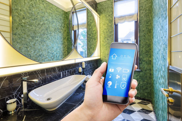 istock smart phone with smart home with modern bathroom 900779168